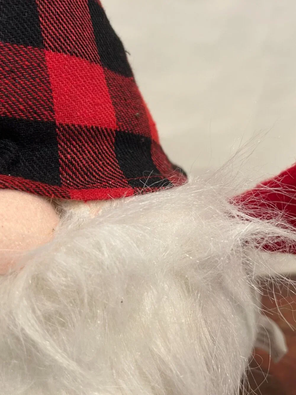 Christmas Holiday Gnome with black and red buffalo plaid cap and wispy white bea